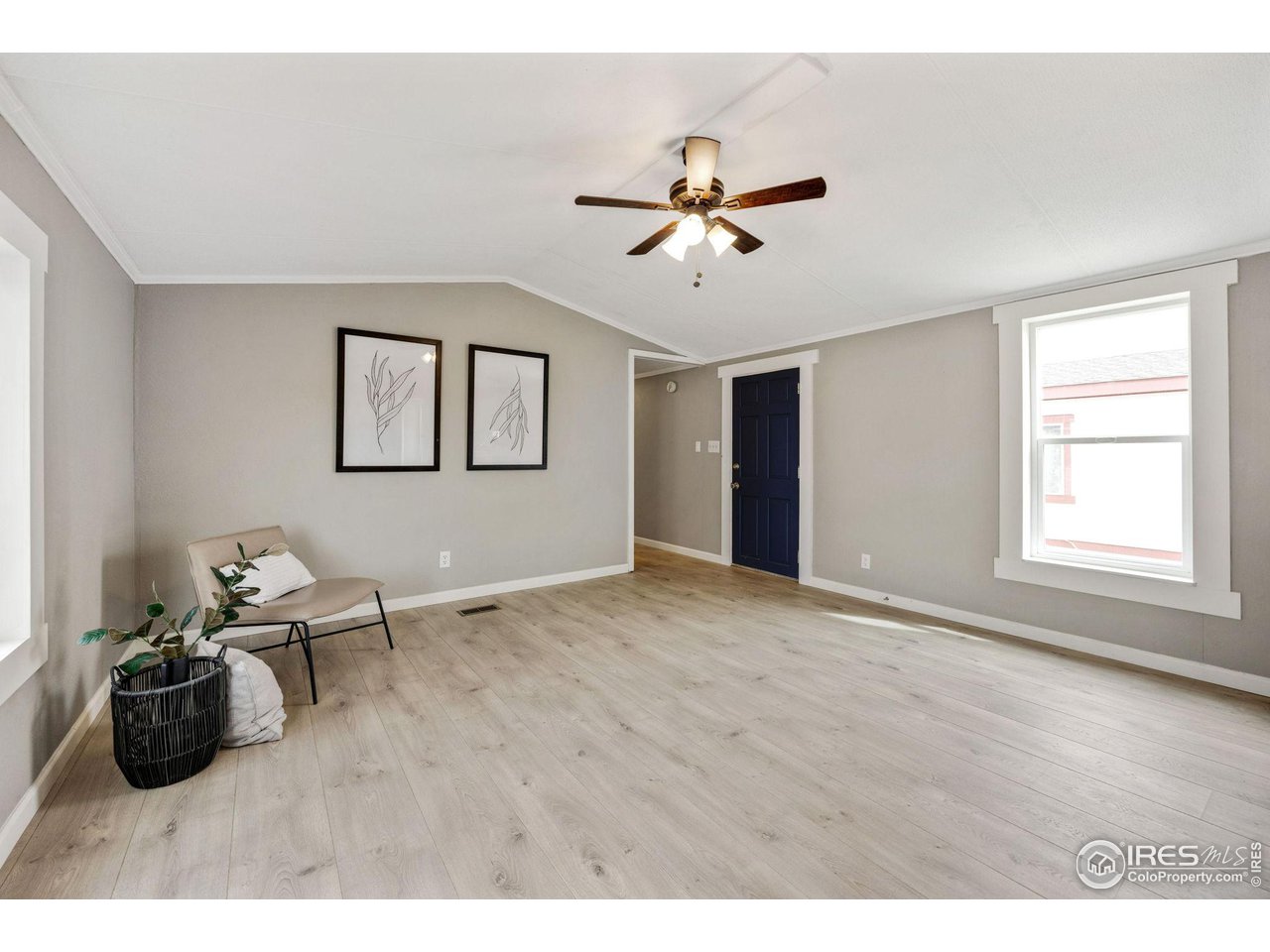 517 East Trilby Road, Unit 102 Fort Collins, CO 80525 - Photo 4 of 19 a view of an empty room and window