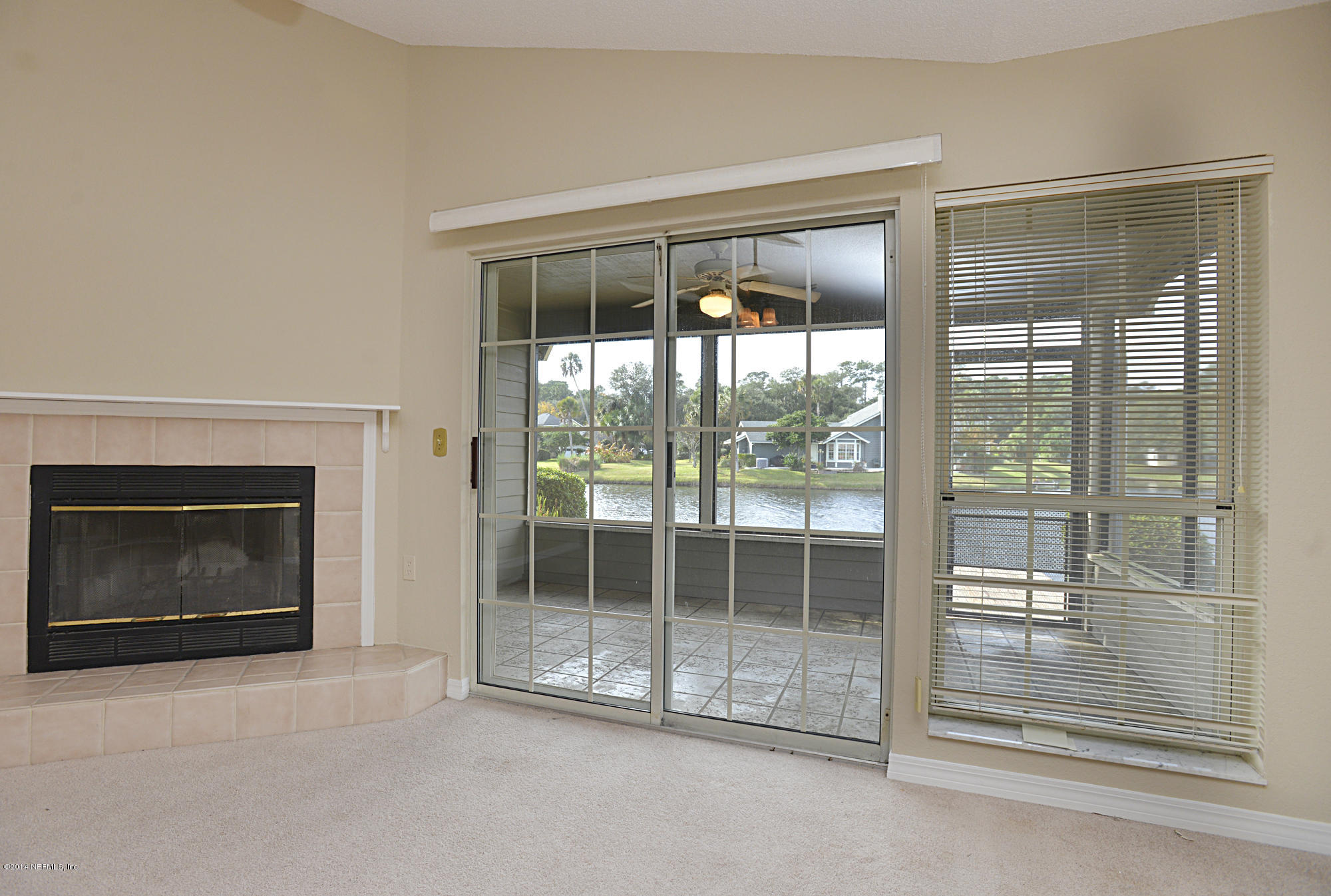 809 Tournament Road Ponte Vedra Beach, FL 32082 - Photo 9 of 28 Fireplace and View of Water from Living