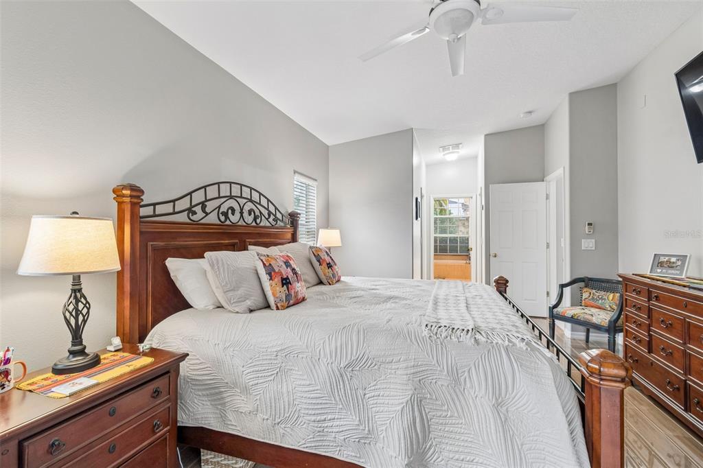 2006 Meadow Rue Court Trinity, FL 34655 - Photo 35 of 96 a bedroom with a bed and a table with lamp