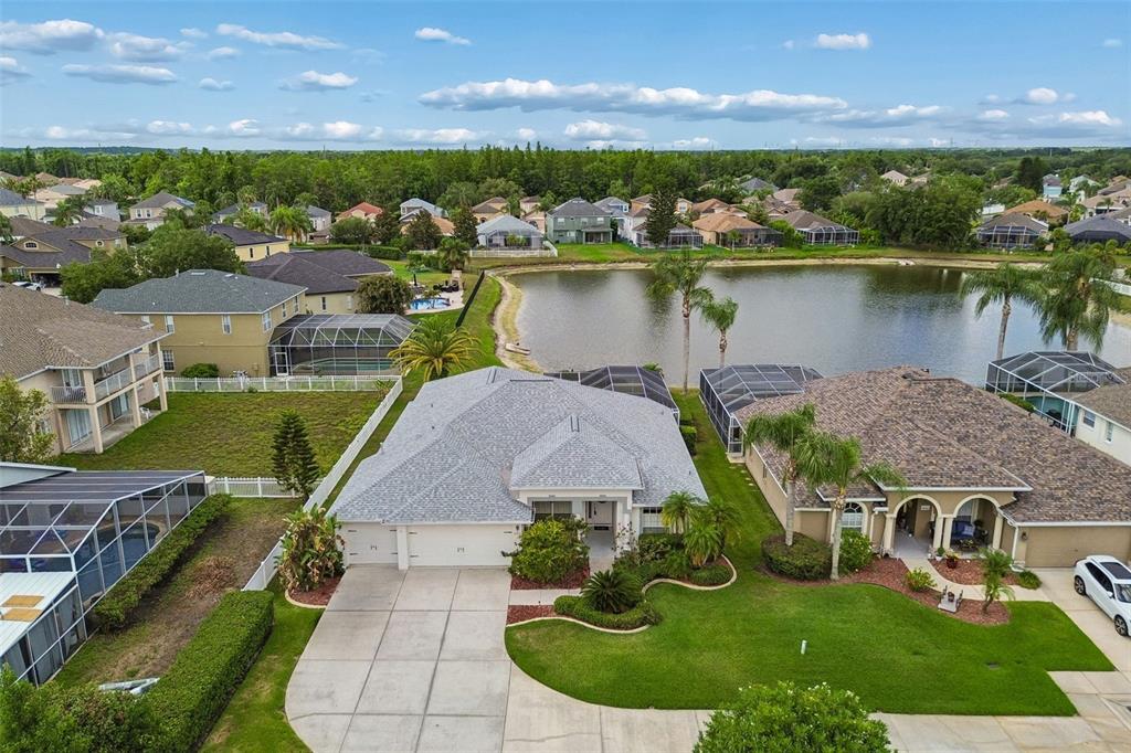 2006 Meadow Rue Court Trinity, FL 34655 - Photo 4 of 96 an aerial view of a house with pool lake view and mountain view