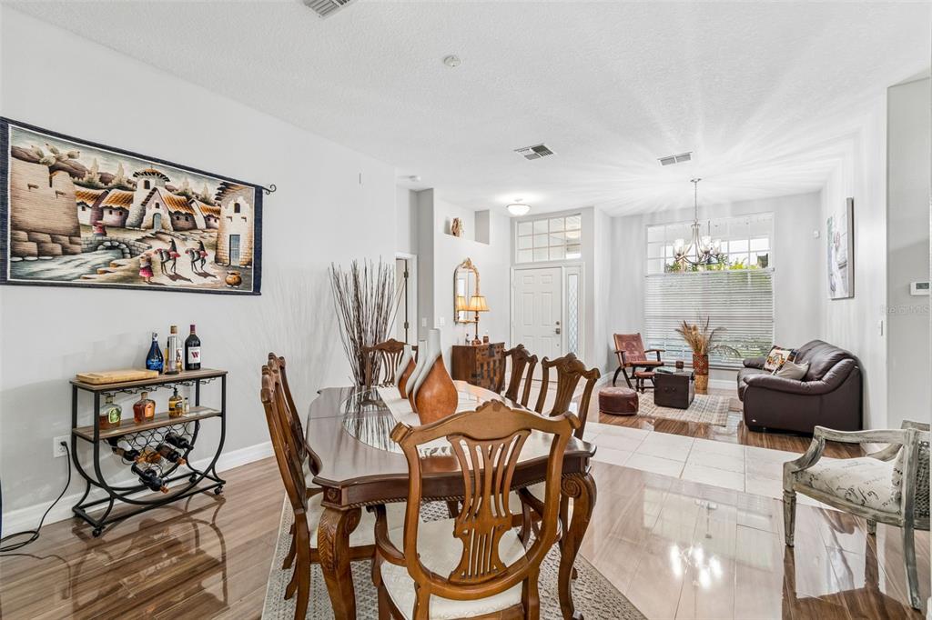 2006 Meadow Rue Court Trinity, FL 34655 - Photo 52 of 96 a view of a dining room with furniture window and wooden floor