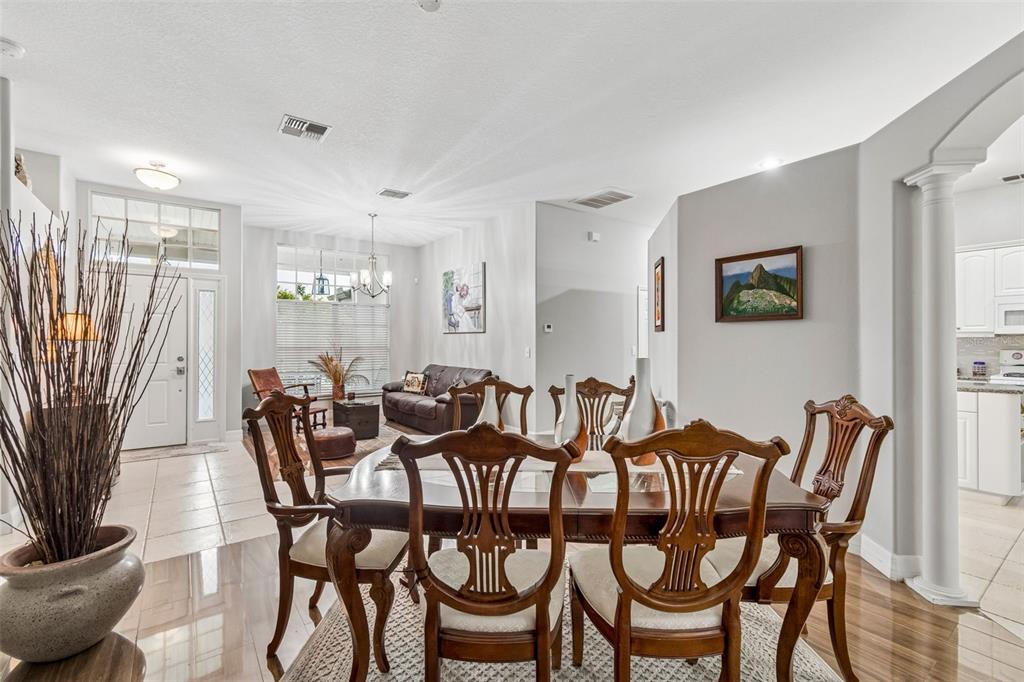 2006 Meadow Rue Court Trinity, FL 34655 - Photo 53 of 96 a view of a dining room with furniture and wooden floor