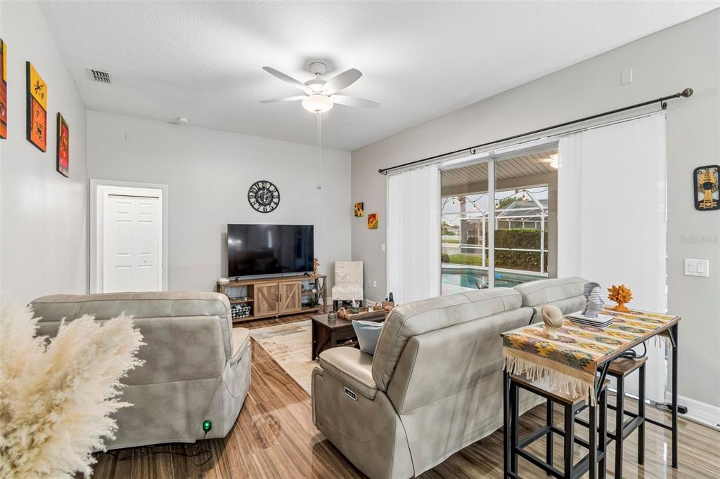 2006 Meadow Rue Court Trinity, FL 34655 - Photo 62 of 96 a living room with furniture and a flat screen tv