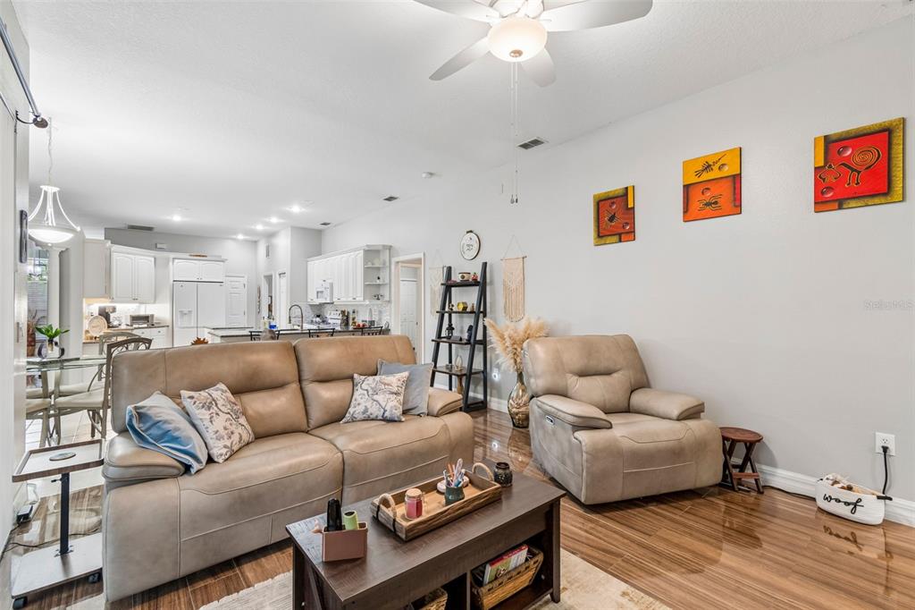 2006 Meadow Rue Court Trinity, FL 34655 - Photo 65 of 96 a living room with furniture and a wooden floor