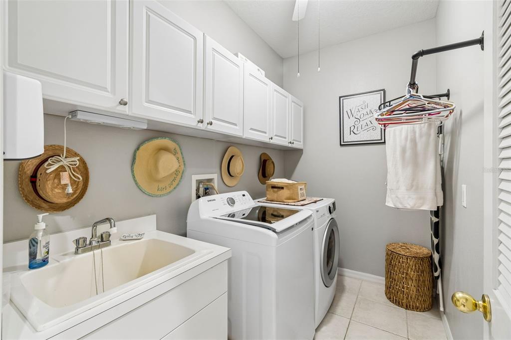 2006 Meadow Rue Court Trinity, FL 34655 - Photo 66 of 96 a bathroom with a sink a vanity and curtain