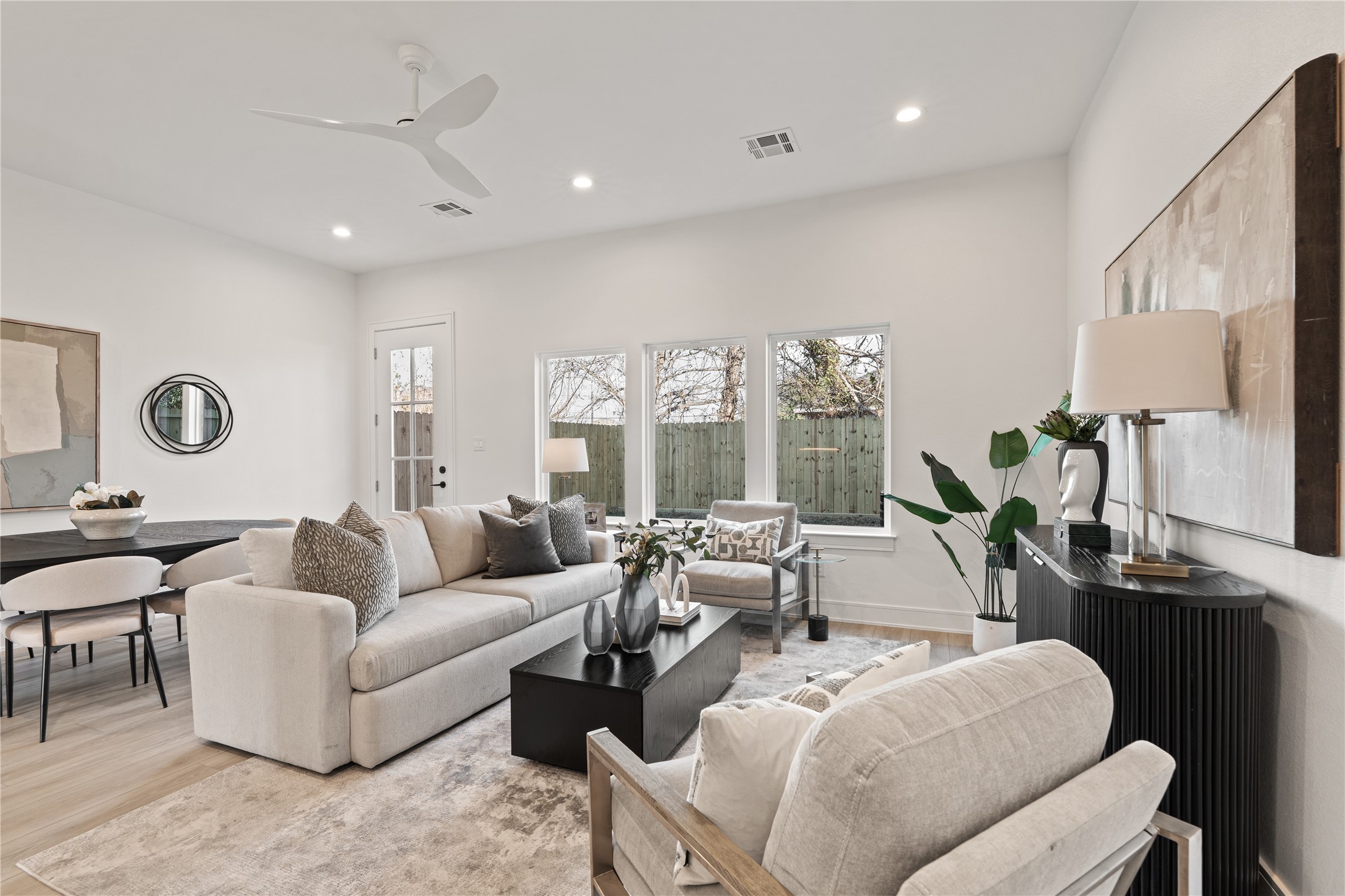 8019 Grandview Street Houston, TX 77051 - Photo 14 of 34 Cozy yet spacious living area with modern staging and backyard views.