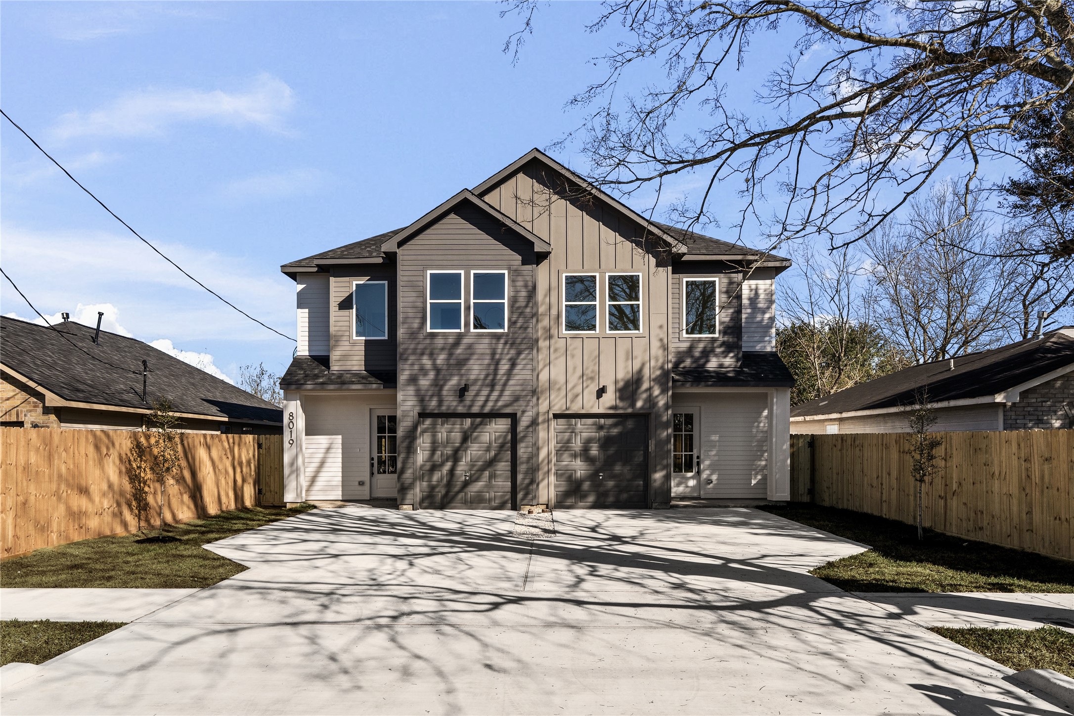 8019 Grandview Street Houston, TX 77051 - Photo 2 of 34 Modern duplex exterior with bold architectural lines, fresh siding, and strong curb appeal.
