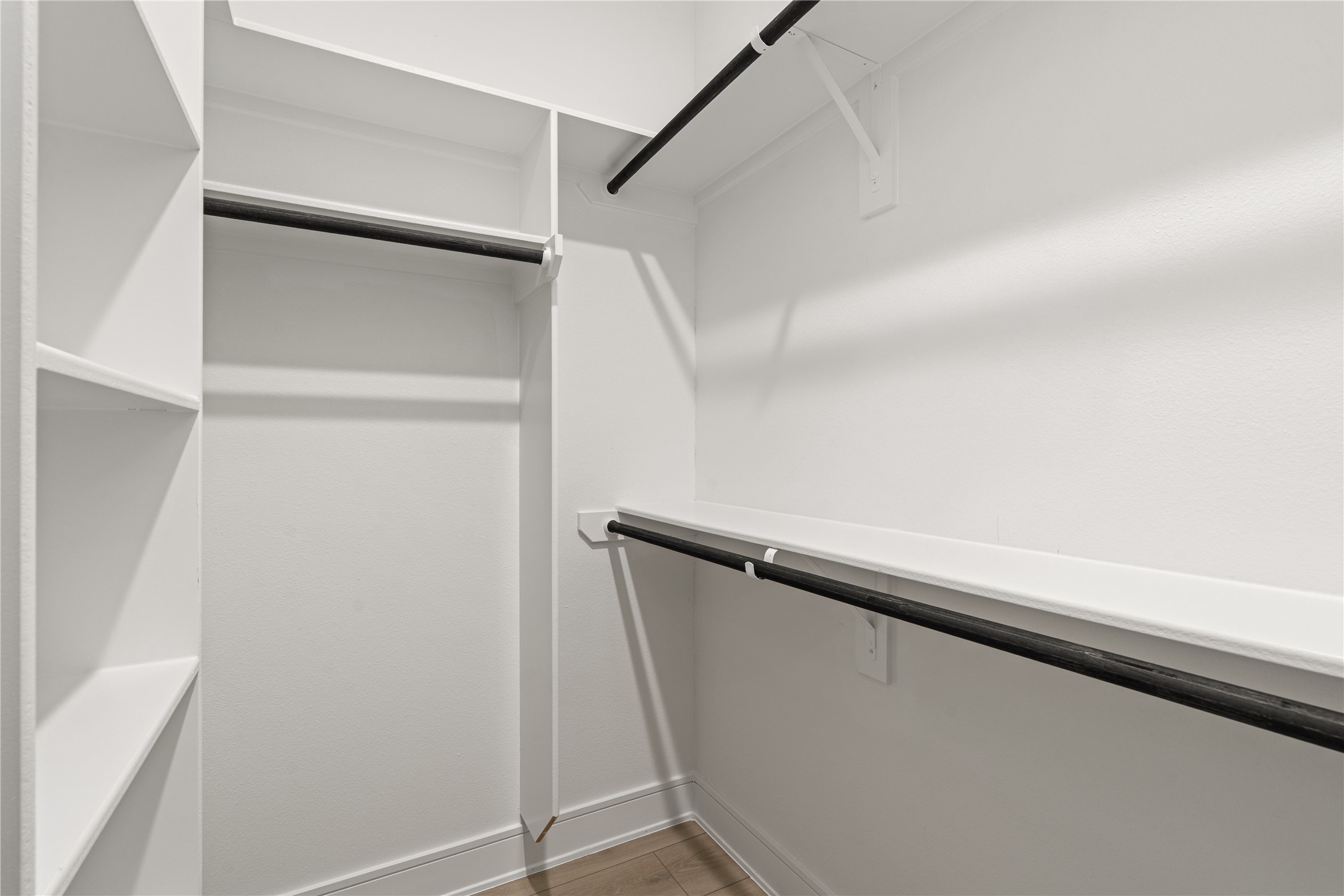 8019 Grandview Street Houston, TX 77051 - Photo 25 of 34 Walk-in closet – shelving and hanging rods on both sides.