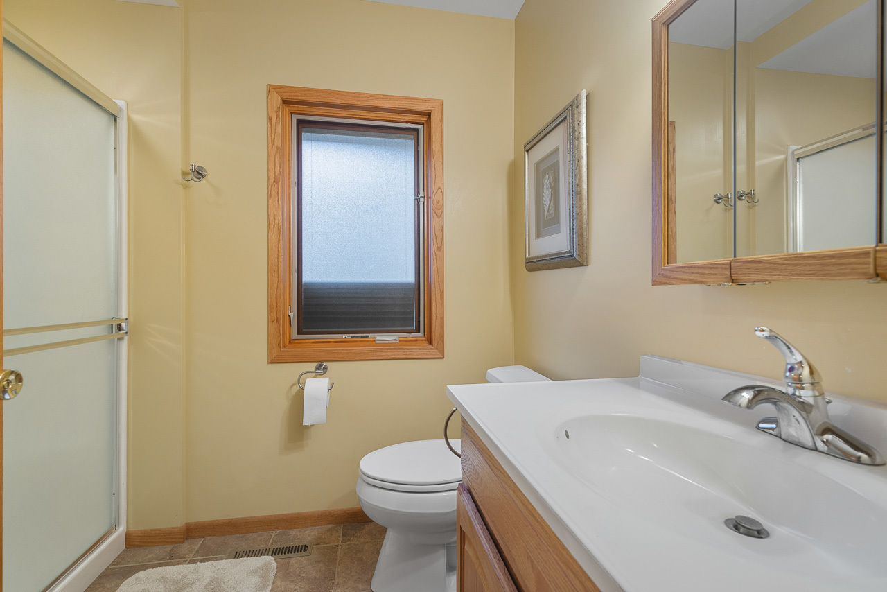 2229 Breckenboro Road Davis, IL 61019 - Photo 27 of 30 a bathroom with a sink a toilet and mirror