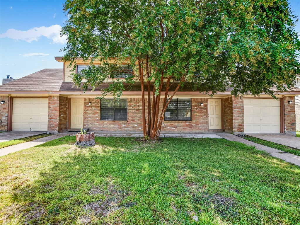 803 Valley View Drive, Unit B Pflugerville, TX 78660 - Photo 1 of 1 front view of a house with a yard