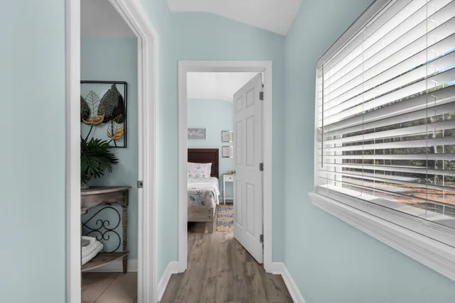 a view of a hallway with closet and a livingroom view