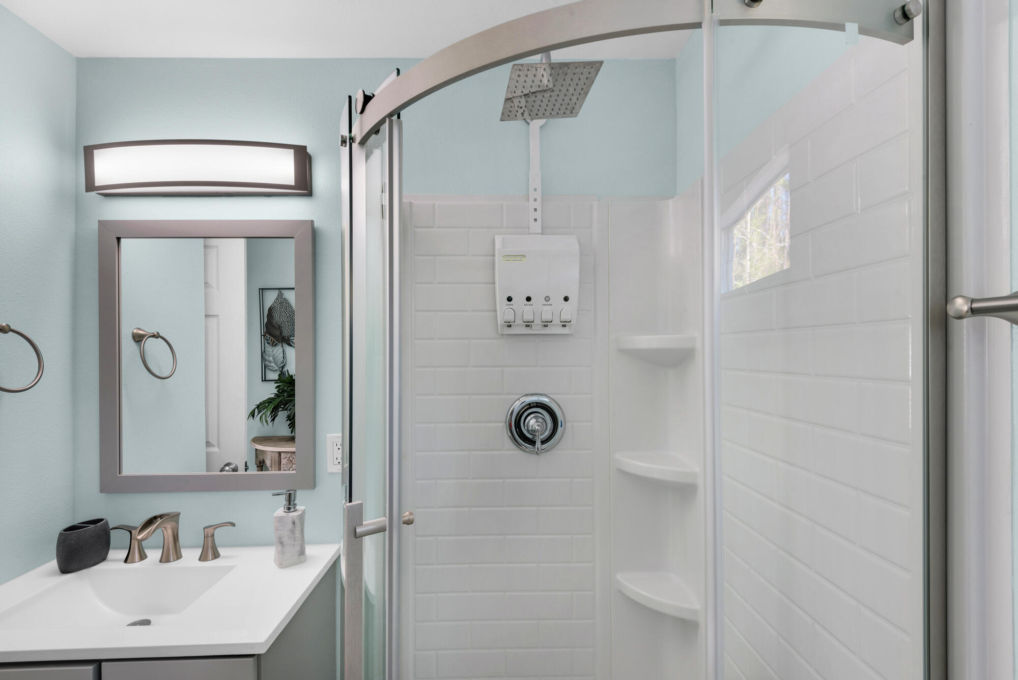 156 McCloud Road Freeport, FL 32439 - Photo 16 of 28 a bathroom with a shower a mirror and a sink