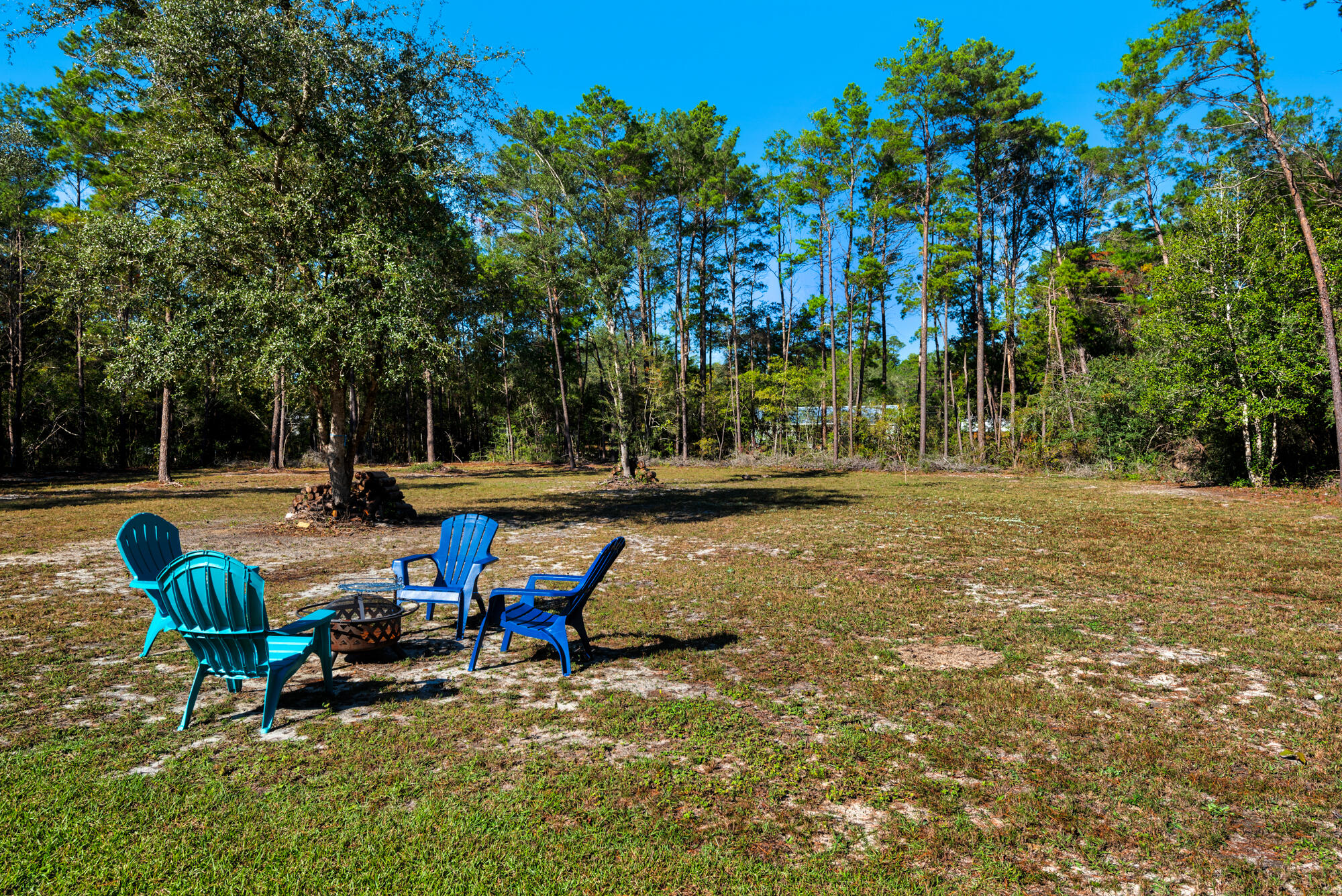 156 McCloud Road Freeport, FL 32439 - Photo 19 of 28 a view of a park with bench and trees