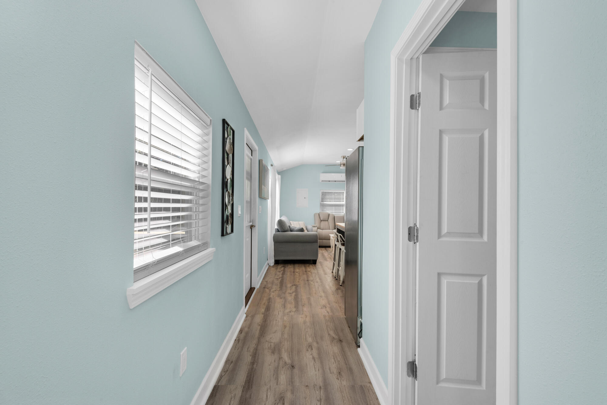 156 McCloud Road Freeport, FL 32439 - Photo 10 of 28 a view of a hallway with wooden floor and staircase