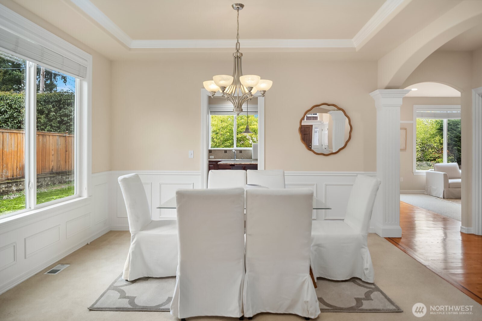 5504 Northeast 13th Place Renton, WA 98059 - Photo 18 of 36 a living room with a table chairs and a large window