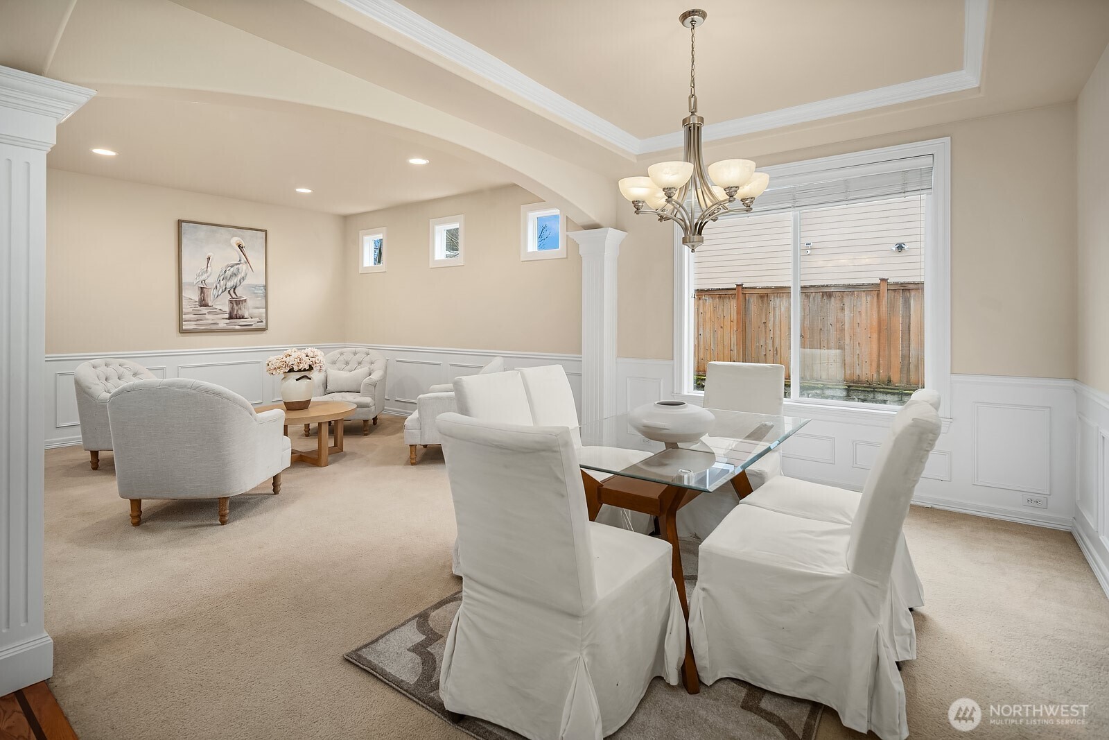 5504 Northeast 13th Place Renton, WA 98059 - Photo 19 of 36 a living room with furniture a chandelier and a chandelier