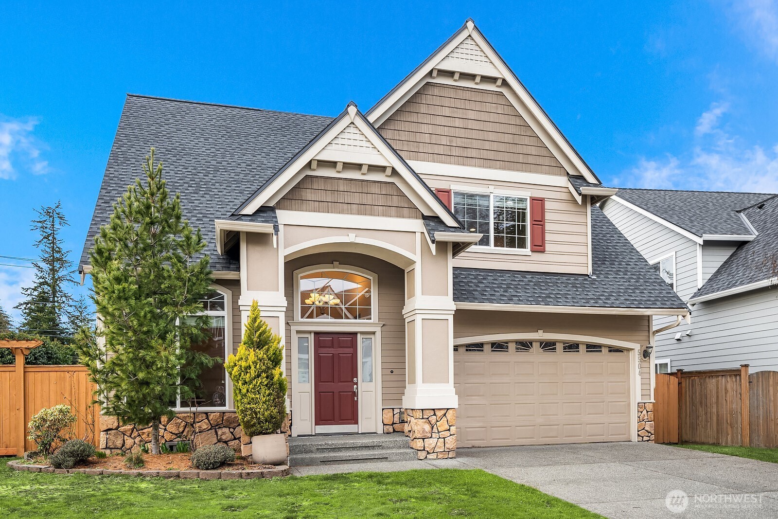 5504 Northeast 13th Place Renton, WA 98059 - Photo 2 of 36 a front view of a house with a yard