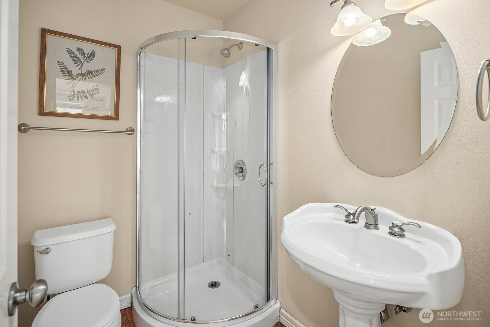 5504 Northeast 13th Place Renton, WA 98059 - Photo 21 of 36 a bathroom with a toilet sink and a mirror