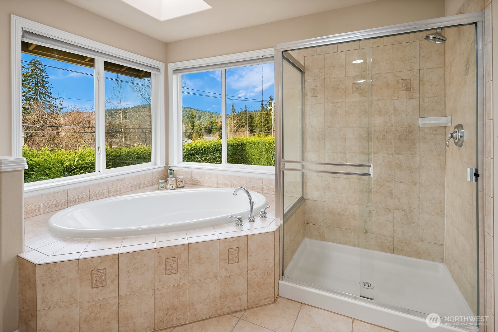 5504 Northeast 13th Place Renton, WA 98059 - Photo 25 of 36 a bathroom with a bathtub and a shower