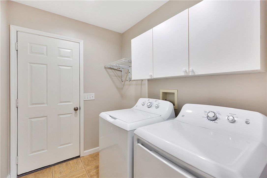 131 Morgan Road West Union, SC 29696 - Photo 15 of 39 Functional utility room with ample storage and full-sized laundry appliances.