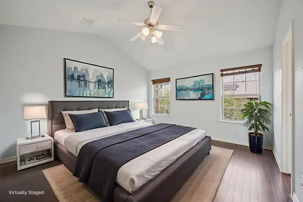 a bedroom with bed and a chandelier