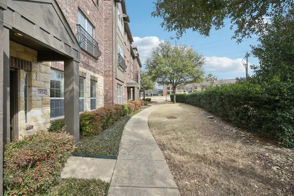 a view of a building with a yard