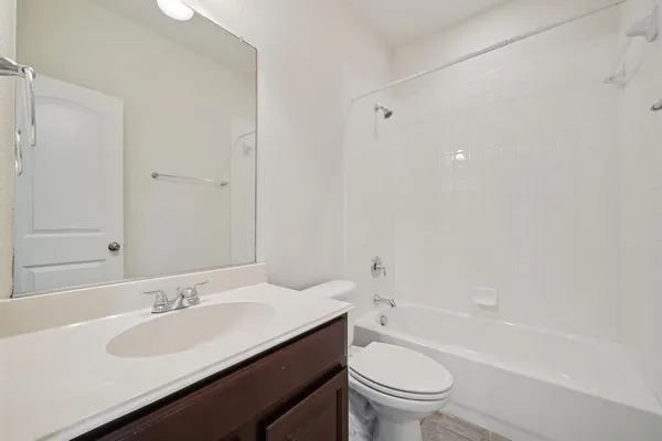 a bathroom with a sink a toilet and a bathtub