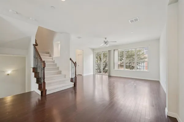 a view of an entryway with wooden floor