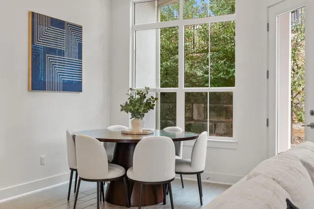 a dining room with furniture and window