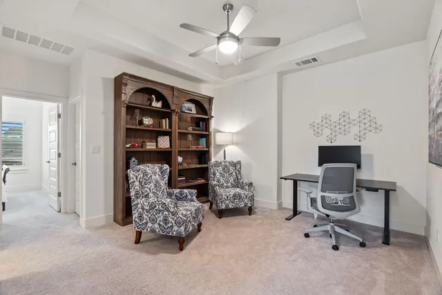 a workspace with furniture and window