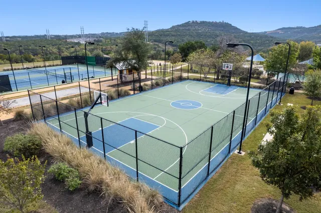 a view of a swimming pool with a yard