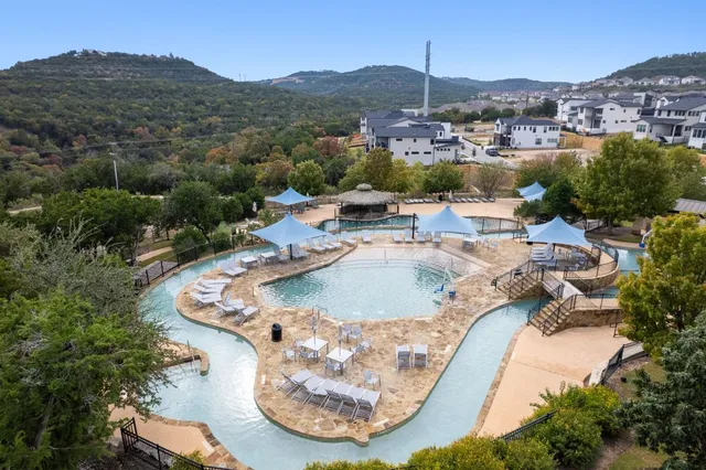 an aerial view of a house with outdoor space