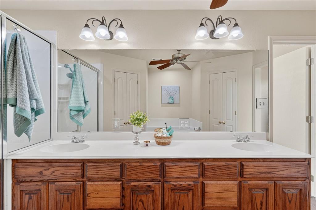 2828 Bennett Road Howe, TX 75459 - Photo 19 of 39 a bathroom with a sink double vanity and a mirror