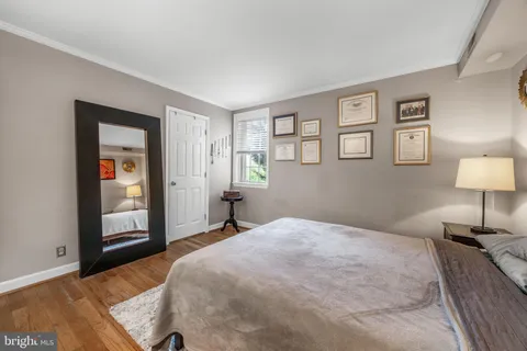 a bedroom with a bed and a lamp