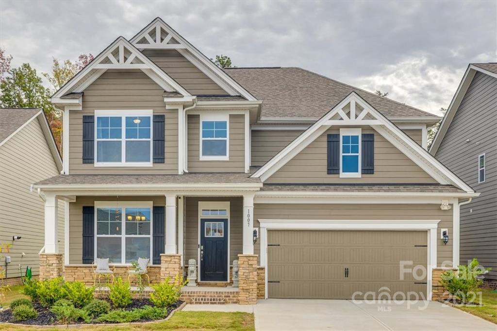 1007 Lydney Circle Waxhaw, NC 28173 - Photo 1 of 46 a front view of a house with garden