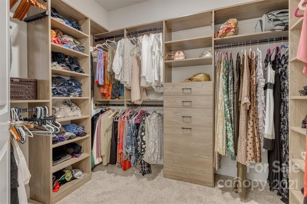 1007 Lydney Circle Waxhaw, NC 28173 - Photo 26 of 46 a view of walk in closet with clothes and shoes