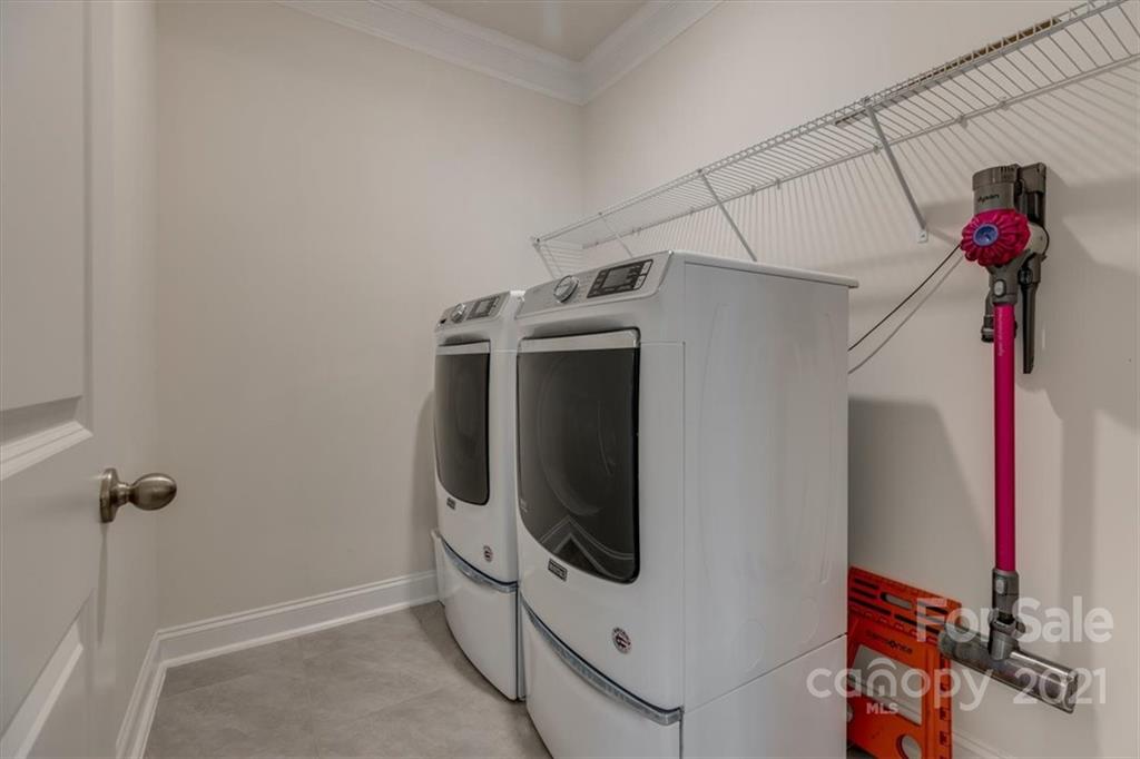 1007 Lydney Circle Waxhaw, NC 28173 - Photo 28 of 46 a view of a storage & utility room with racks on the wall