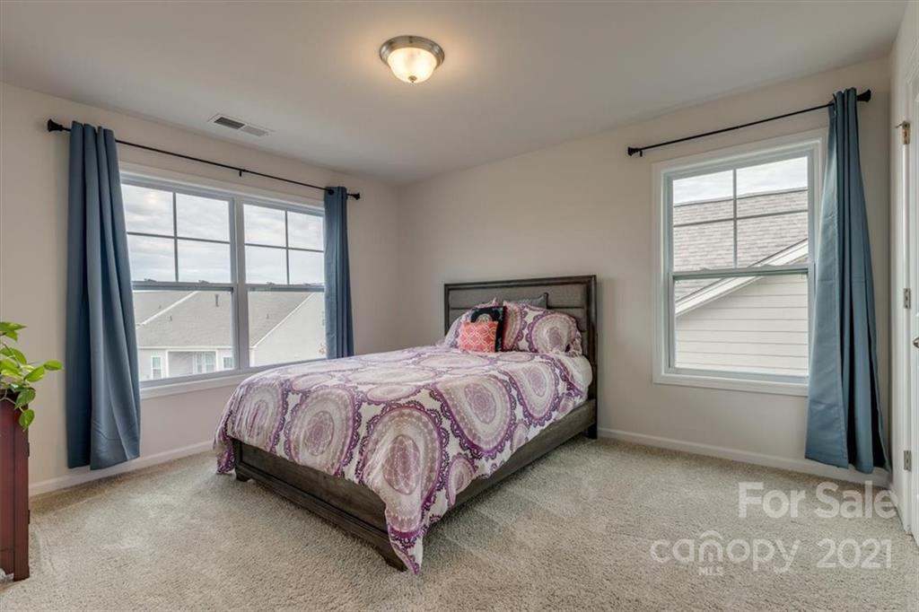1007 Lydney Circle Waxhaw, NC 28173 - Photo 38 of 46 a bed sitting in a bedroom next to a window