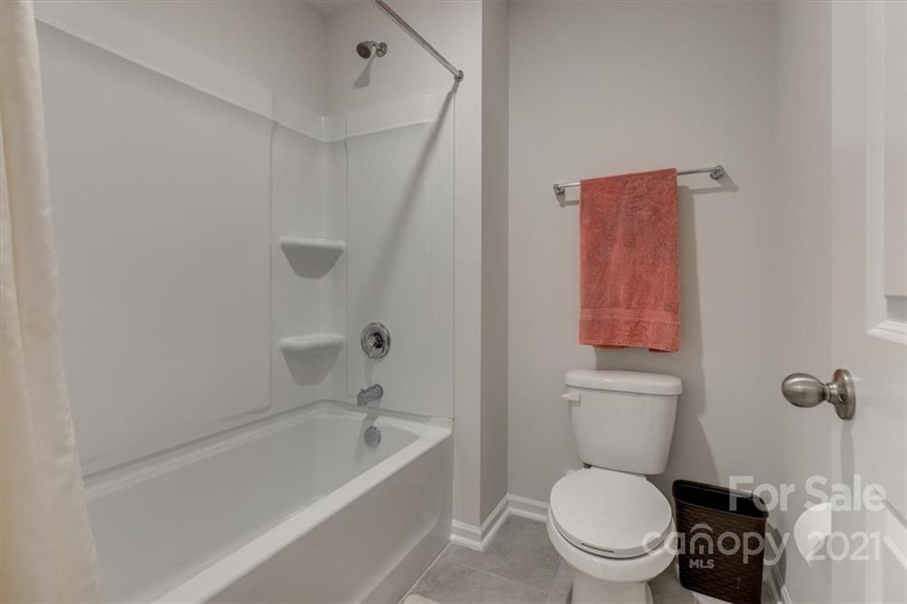 1007 Lydney Circle Waxhaw, NC 28173 - Photo 41 of 46 a white toilet sitting next to a bath tub
