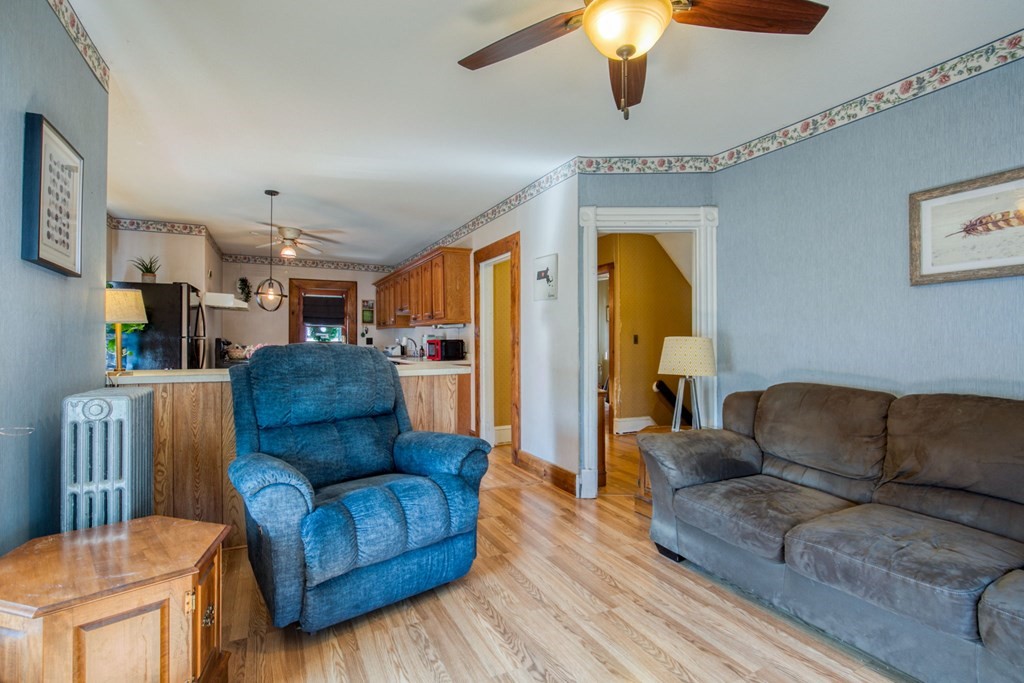 2129 Northampton Street Holyoke, MA 01040 - Photo 11 of 25 a living room with furniture and a wooden floor