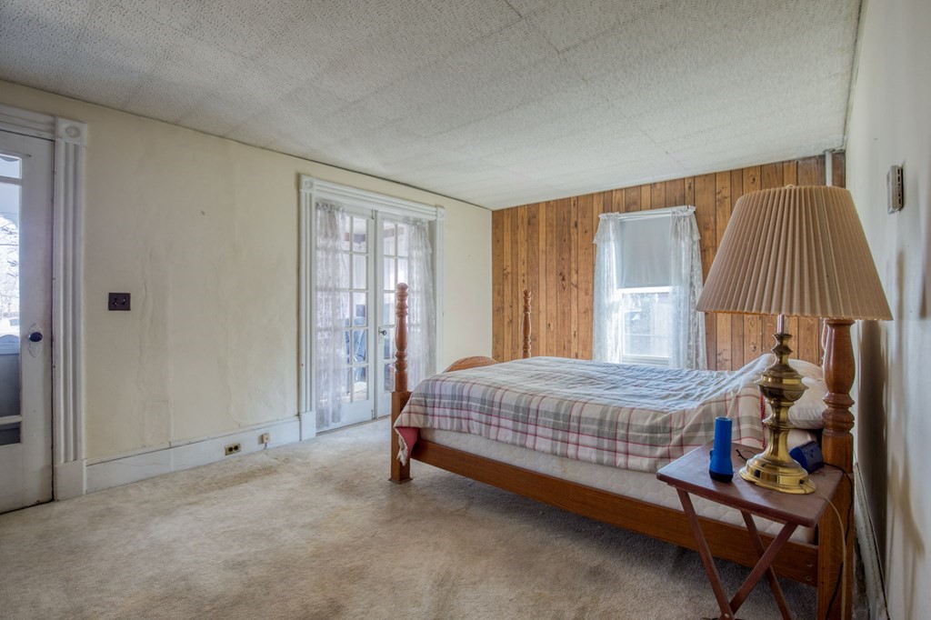 2129 Northampton Street Holyoke, MA 01040 - Photo 16 of 25 a bedroom with a bed and a window
