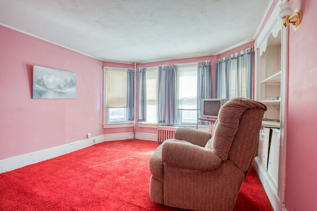 2129 Northampton Street Holyoke, MA 01040 - Photo 22 of 25 a living room with furniture and a large window