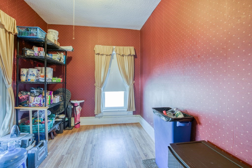 2129 Northampton Street Holyoke, MA 01040 - Photo 8 of 25 a view of hallway with cabinets and wooden floor