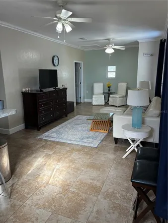 a living room with lots of furniture and a flat screen tv
