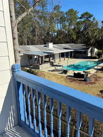 a view of a swimming pool with a chairs