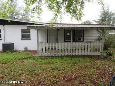 7655 Falcon Street Jacksonville, FL 32244 - Photo 12 of 13 a front view of a house with a yard