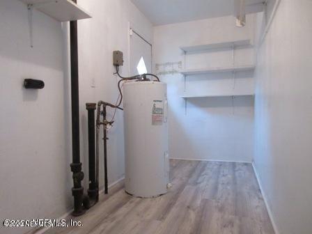 7655 Falcon Street Jacksonville, FL 32244 - Photo 6 of 13 a view of a room with wooden floor
