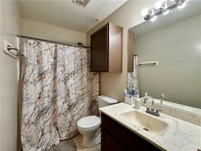 a bedroom with a bed and a cabinets