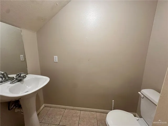 a view of balcony with a small yard