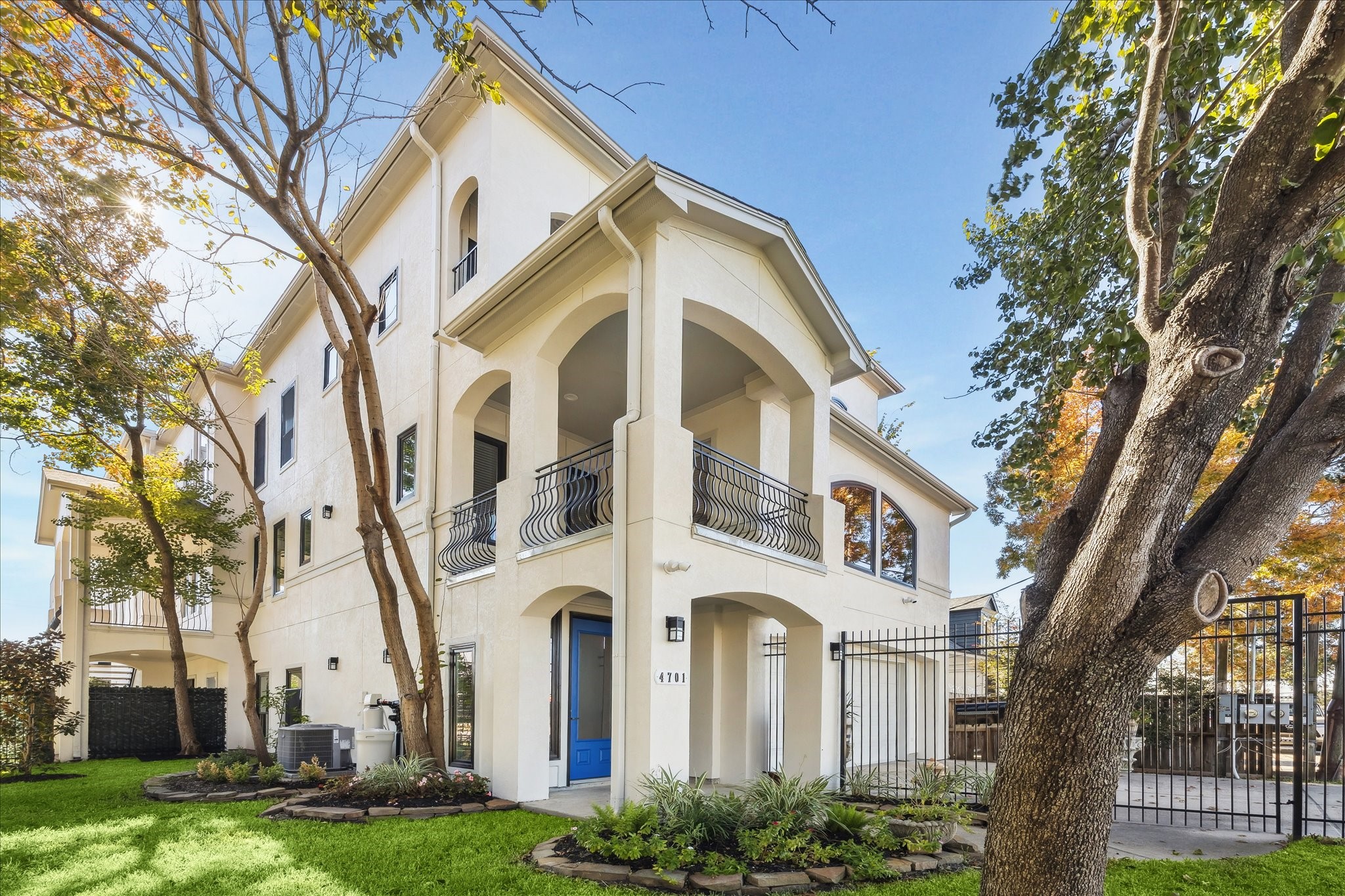 4701 Inker Street Houston, TX 77007 - Photo 1 of 45 a front view of a white building with yard and green space